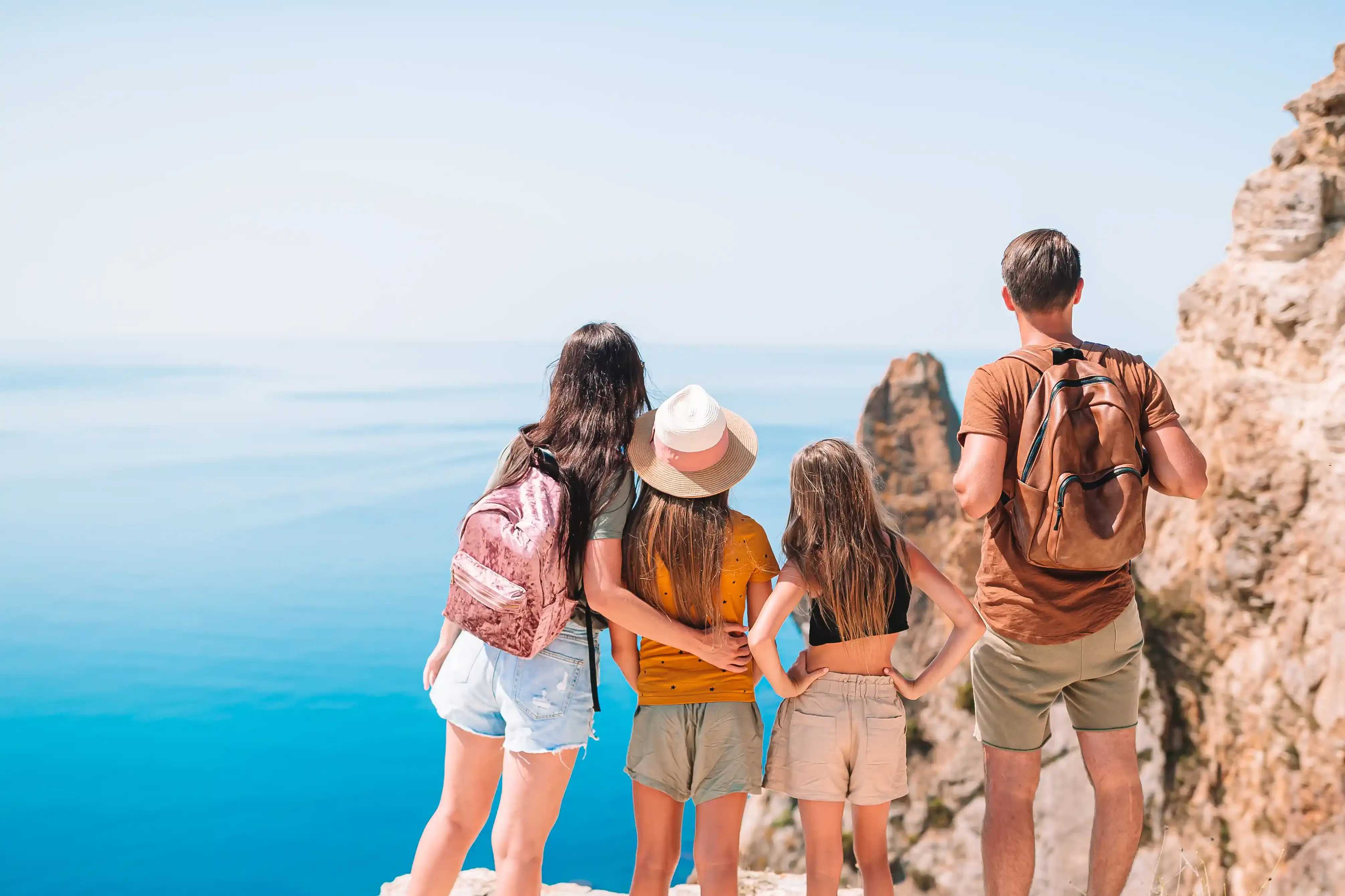 Family on top of a mountain hill